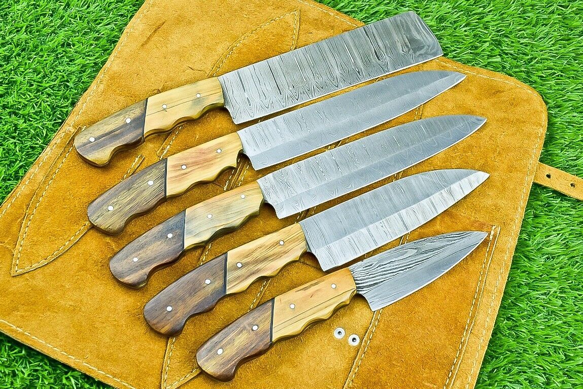 Handmade 5 piece Damascus steel chef knife set with natural olive wood handles, organized in a premium hand stitched leather roll.
