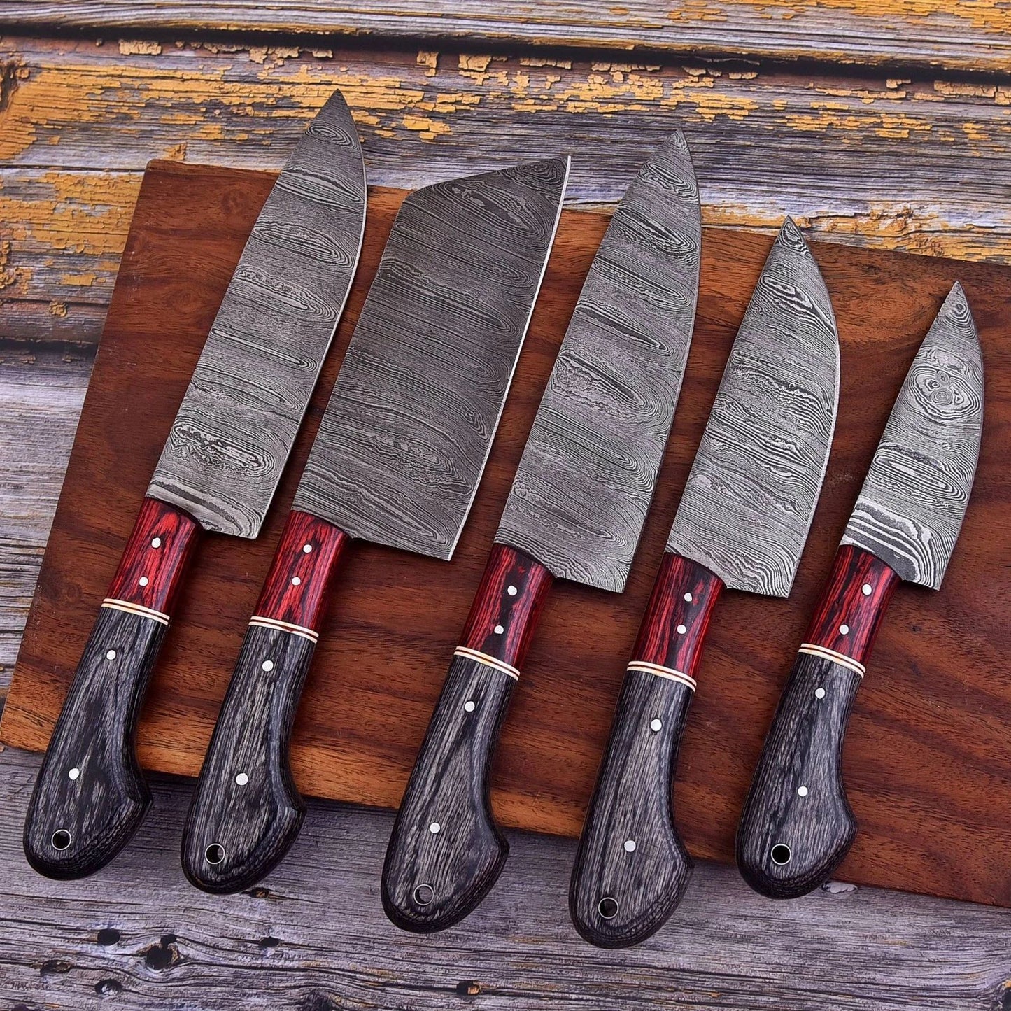 Professional 5 pc custom Damascus steel kitchen knife set featuring hand engraved bone handles and decorative mosaic pins.