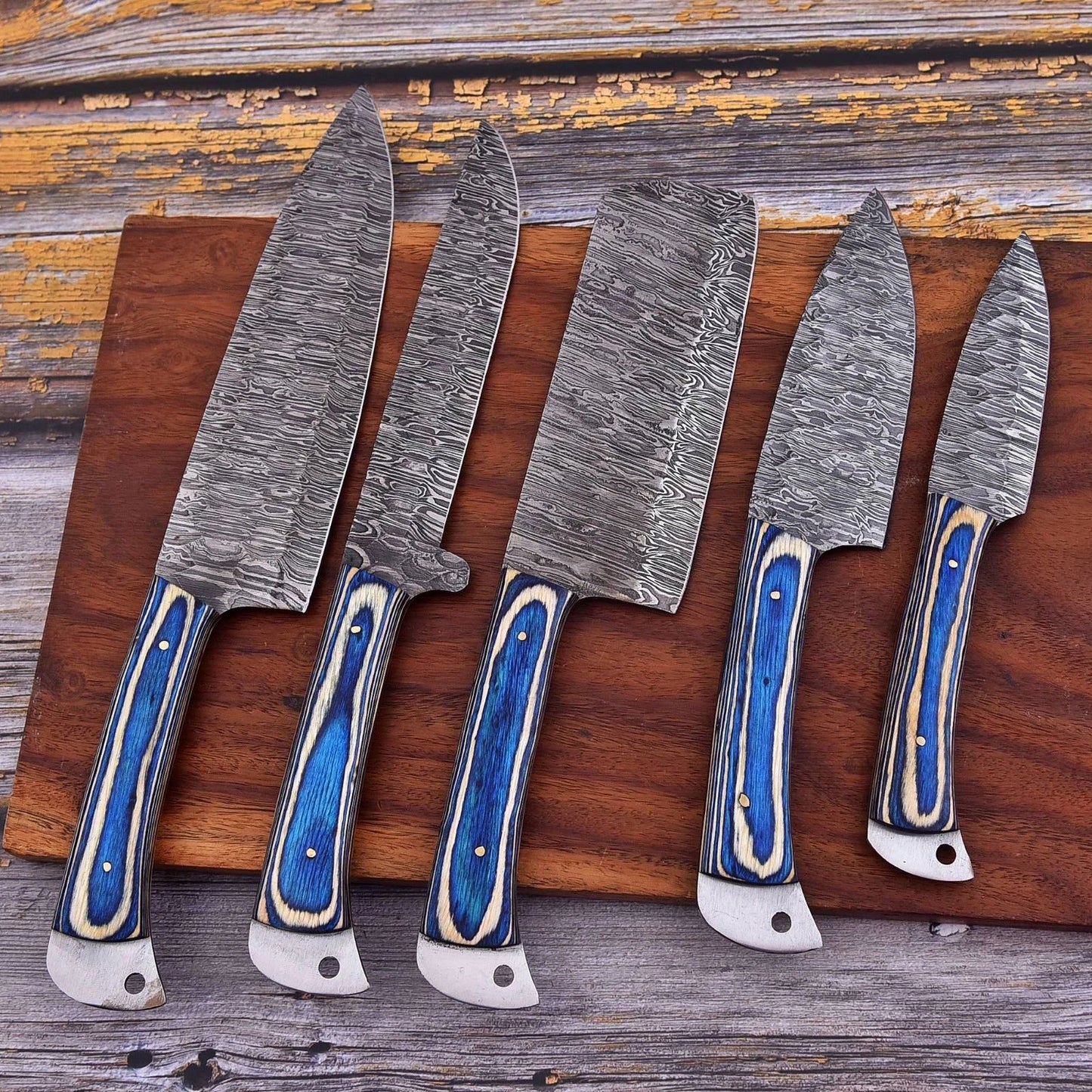 Hand forged 5 pc Damascus steel kitchen knife set featuring elegant engraved bone handles and decorative mosaic pins.