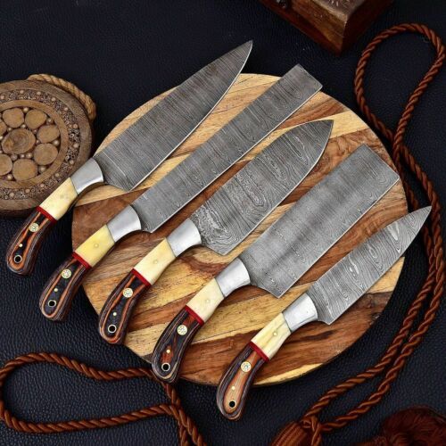 Handmade 5 piece Damascus steel kitchen knife set featuring unique bone, wood, and steel bolster handles.