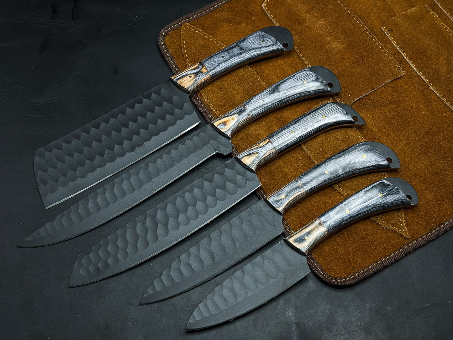 Handmade 5-piece carbon steel kitchen and survival knife set with wood handles and leather sheaths.