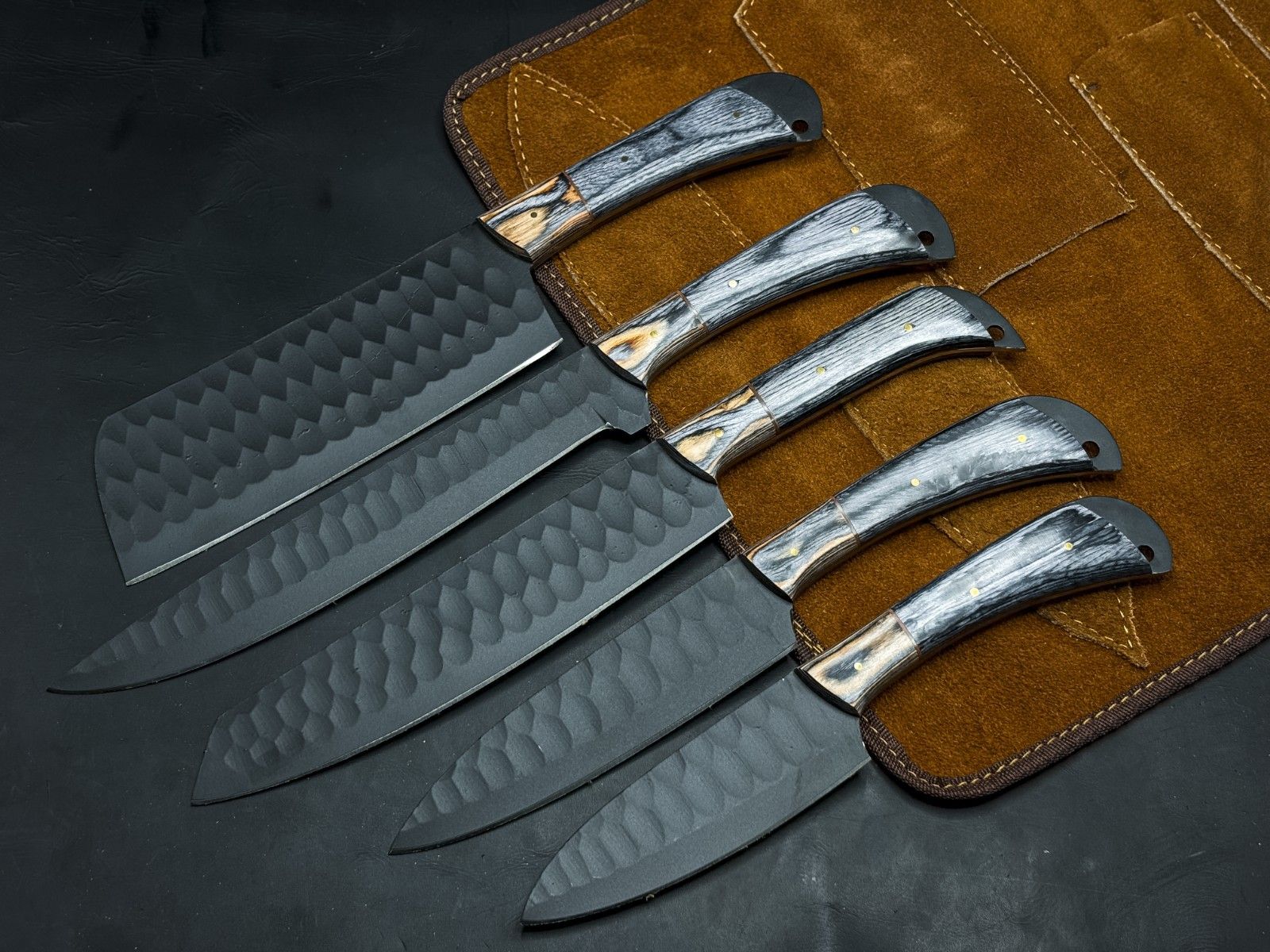 Handmade 5-piece carbon steel kitchen and survival knife set with wood handles and leather sheaths.