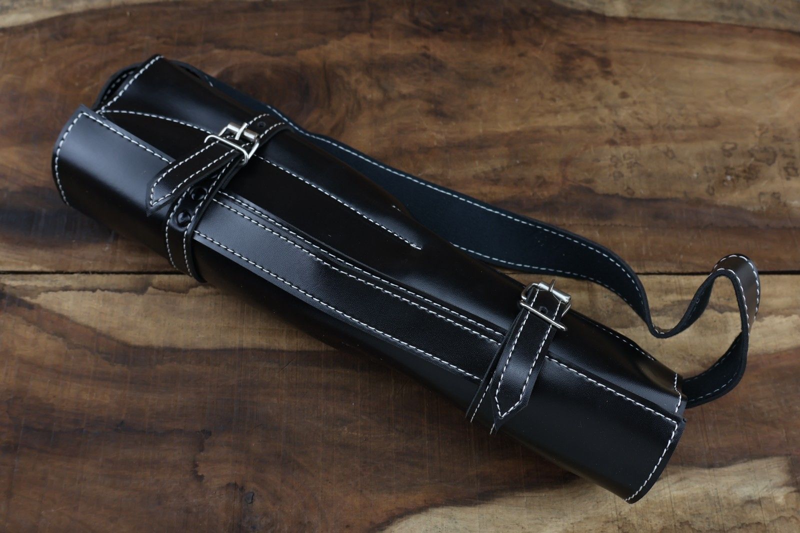 Hand stitched leather roll kit containing a 5 pc handmade Damascus steel chef knife set with premium olive wood handles.