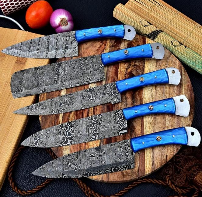 Handmade 5 pc Damascus steel chef knife set featuring vibrant blue resin handles and protective leather sheaths.