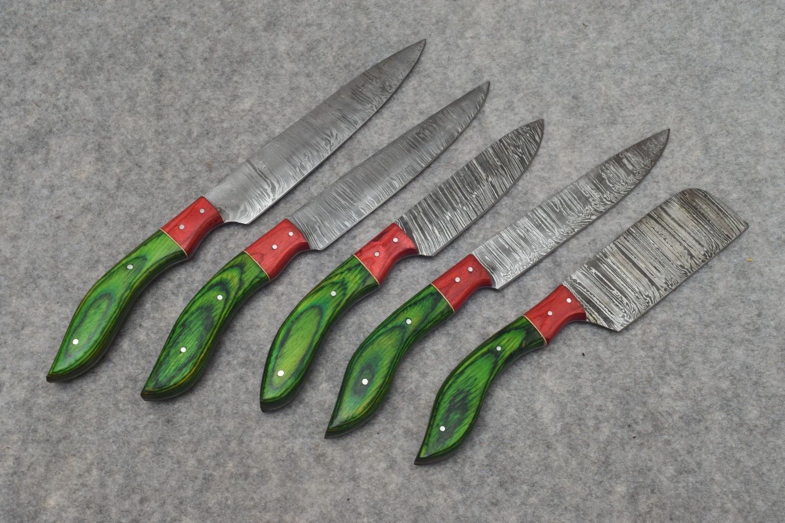 Handmade 5 pc Damascus steel chef knife set featuring unique natural wood grain handles and leather sheath storage.
