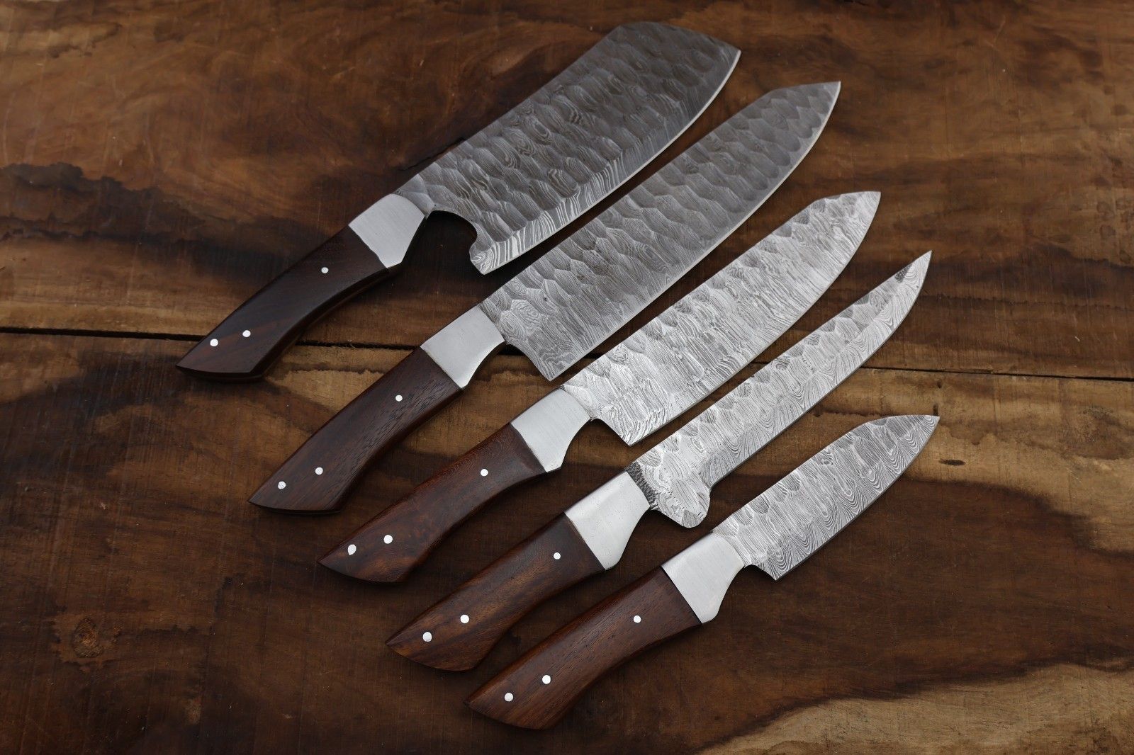 Hand forged 5 pc Damascus steel chef knife set with natural hardwood handles, brass mosaic pins, and custom leather sheaths.