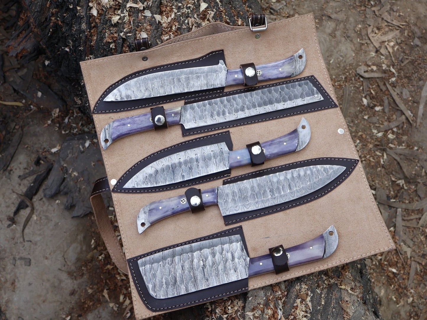 Complete 5 pc Damascus steel chef knife set stored safely in individual leather sheaths.