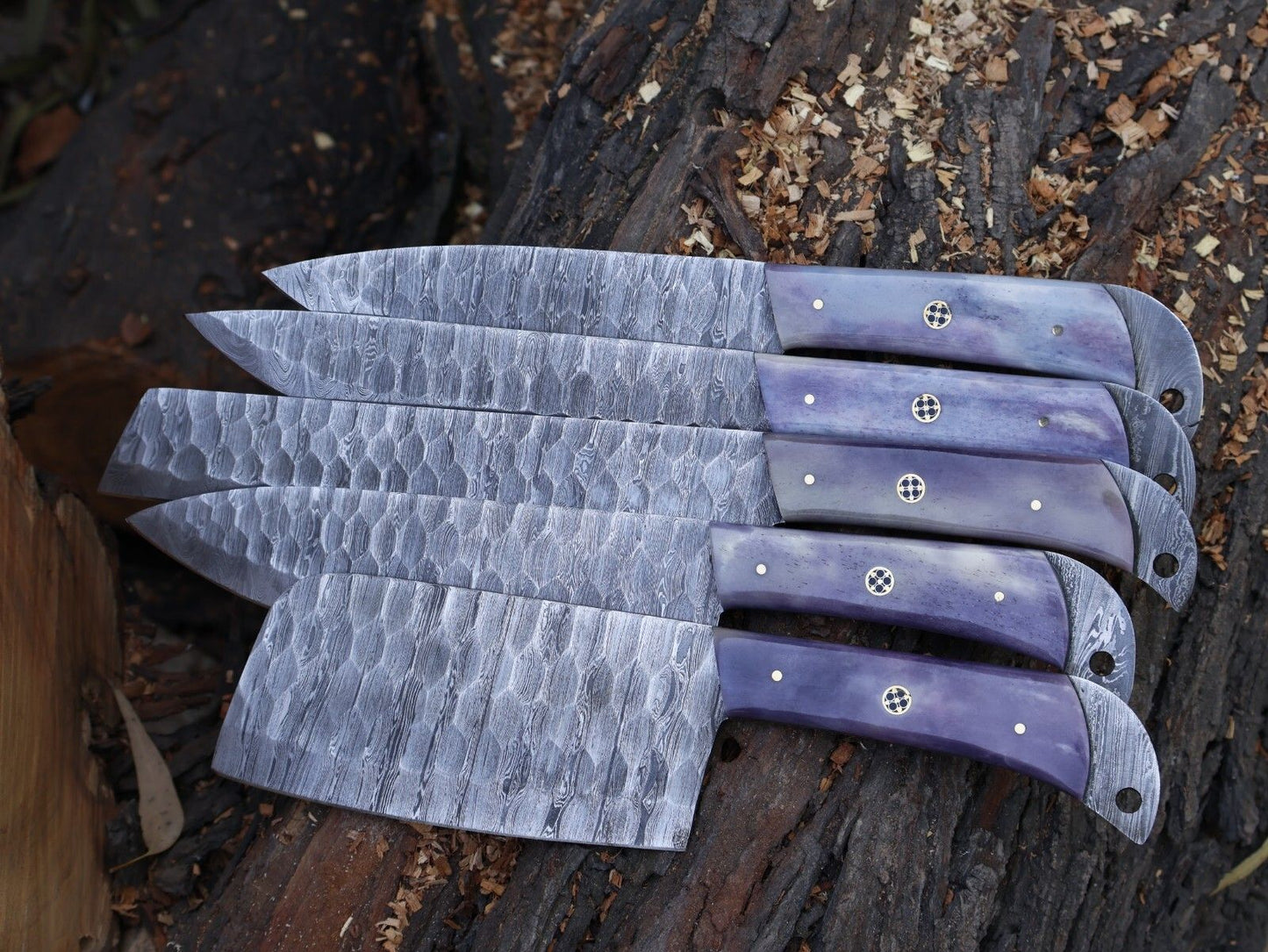 Complete 5 pc Damascus steel chef knife set stored safely in individual leather sheaths.