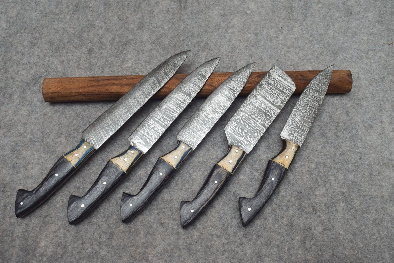 Complete 5 pc handmade Damascus kitchen knife collection, varying from 8 to 12 inches for versatile culinary tasks. 